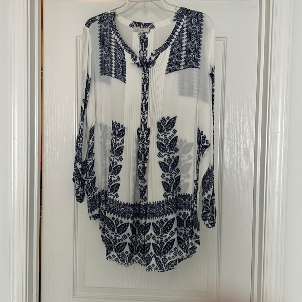 Pale Sky mid length sleeve shirt.